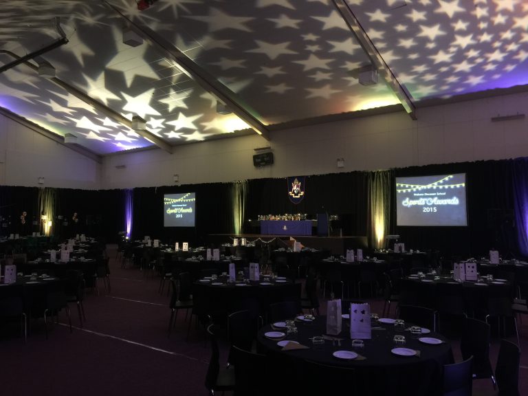 Gym Draped for Awards Night 2015 Gobo lights on roof for feature